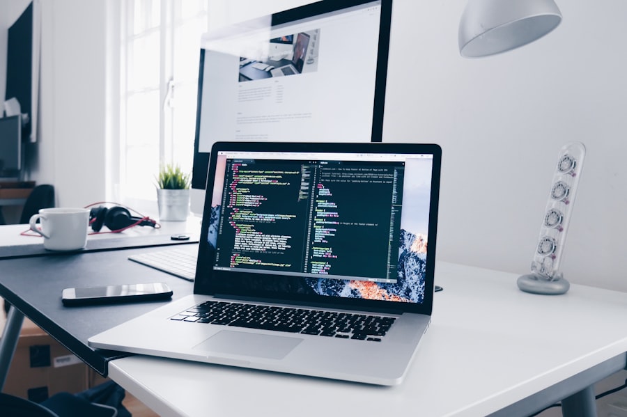 Laptop with automation code in a bright workspace