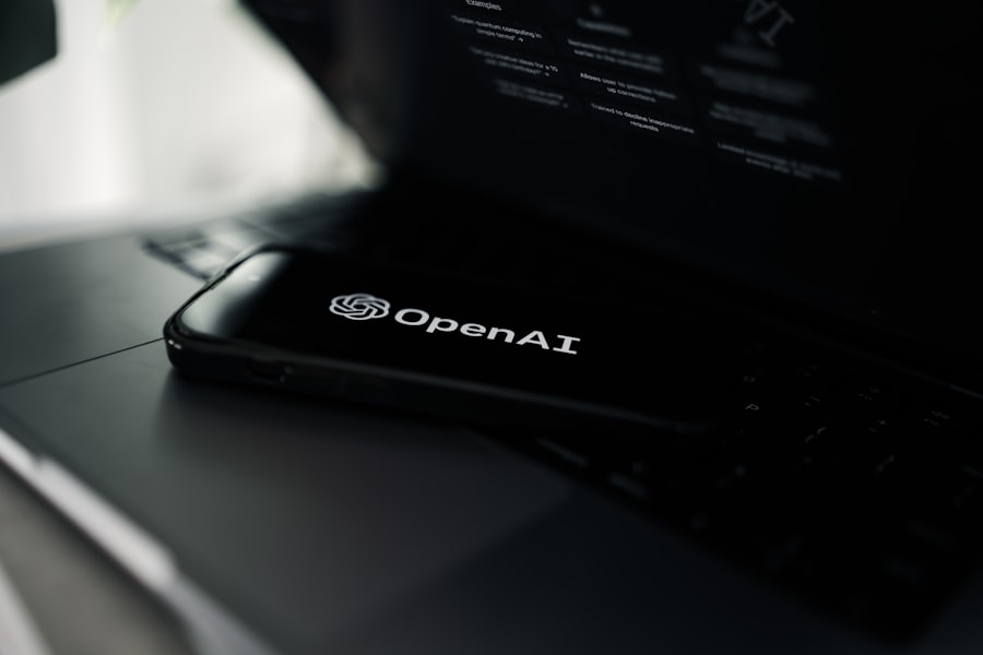 Phone showing the OpenAI app resting on a laptop keyboard